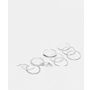 ASOS DESIGN pack of 12 rings with twist details and engraved designs in silver tone
